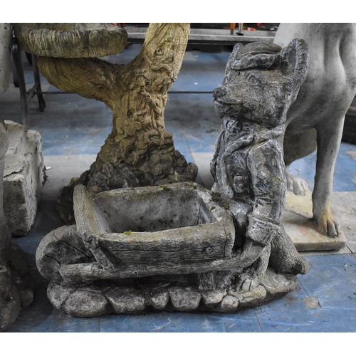 473 - A Reconstituted Stone Garden Planter in the Form of a Fox Pushing a Wheelbarrow, 51cms Wide and 52cm... 