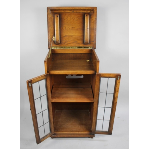 520 - A Glazed Oak Music Cabinet, 54cms Wide