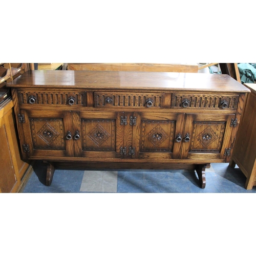 524 - A Mid 20th century Oak Sideboard with Three Top Drawers Over Cupboards, 167cm Wide