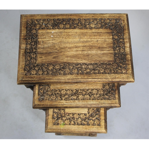 527 - A Far Eastern Nest of Three Tables with Carved Tops, 45.5cms Wide