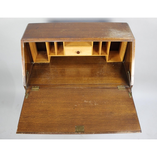 529 - A Mid 20th Century Oak Fall Front Bureau with Three Drawers, 76cms Wide