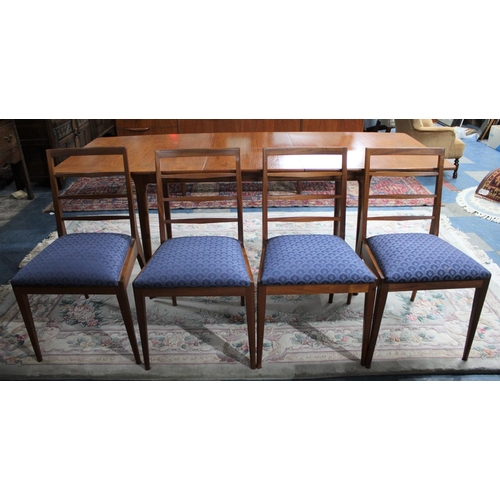 546 - A McIntosh Teak Extending Dining Table and Four Ladder Back Chairs