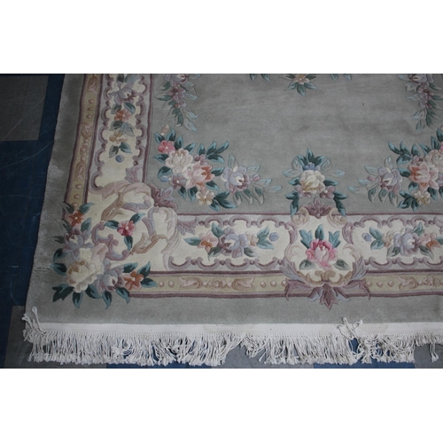 548 - A Chinese Patterned Woollen Rug, 282x181cms