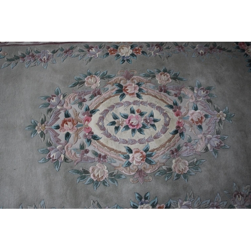 548 - A Chinese Patterned Woollen Rug, 282x181cms