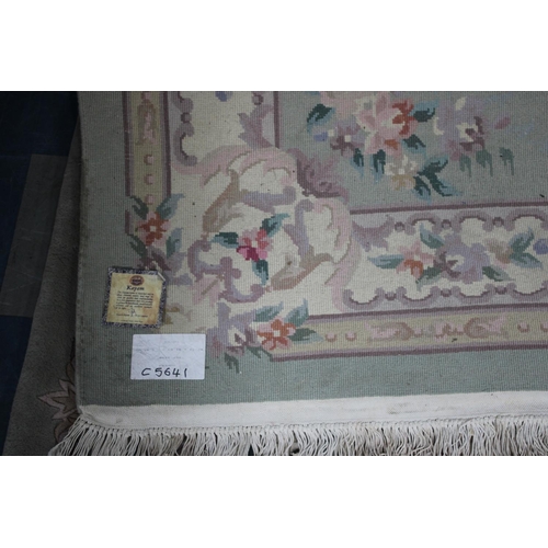 548 - A Chinese Patterned Woollen Rug, 282x181cms