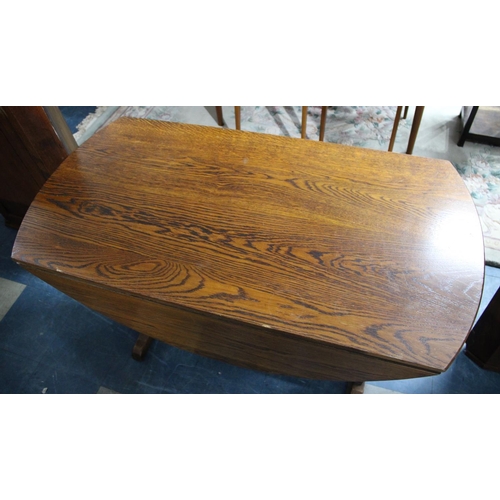 551 - A Mid 20th Century Oak Oval Top Drop Leaf Dining Table, 121cms Wide