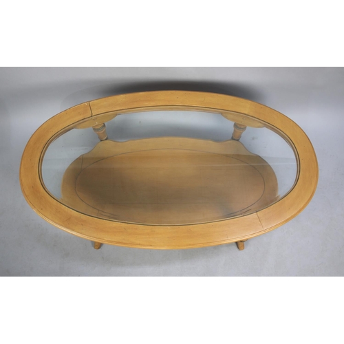 560 - A Modern Oval Coffee Table with Stretcher Shelf, 126cms Wide