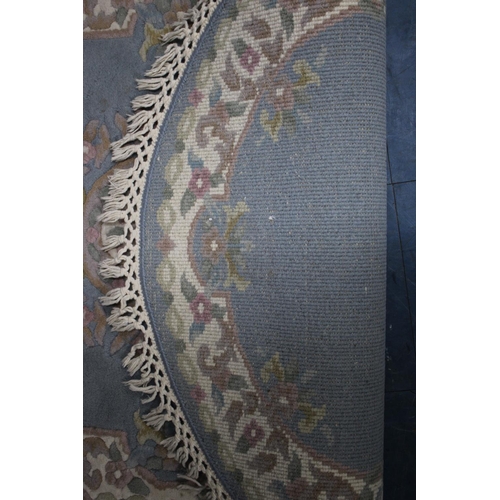 566 - A Chinese Oval Woollen Rug, 154x95cms