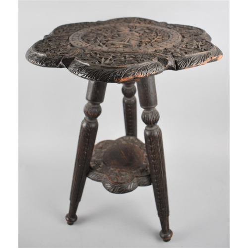 65 - A Scallop Edged Two Tier Carved Indian Table on Turned Tripod Supports, 38cms Diameter