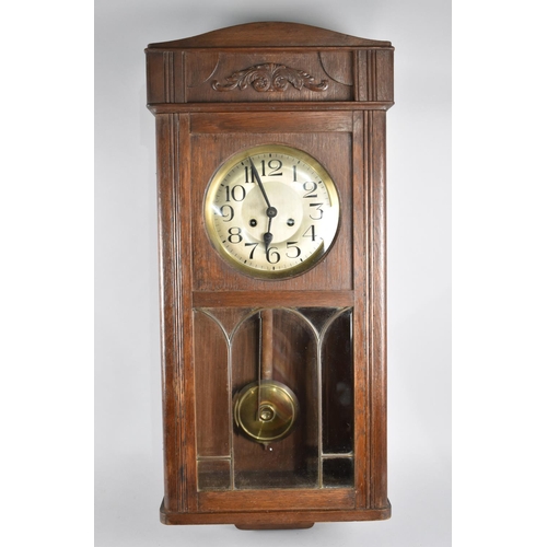 76 - An Edwardian Oak Wall Clock, 81cms High