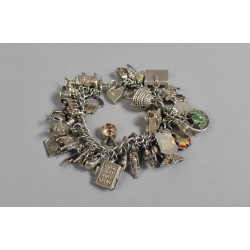 397 - A Silver Charm Bracelet with Quantity of Charms