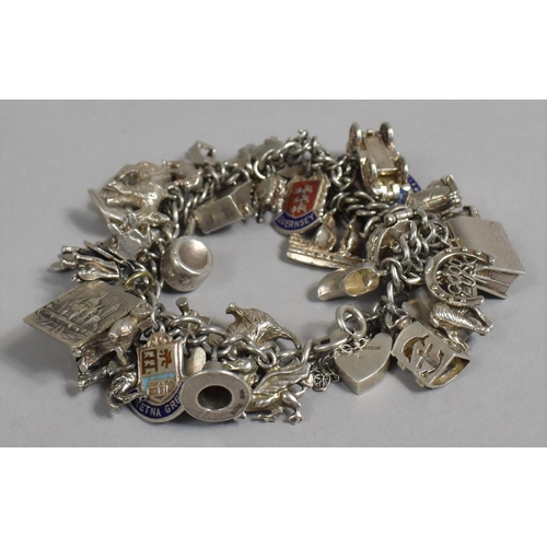 397 - A Silver Charm Bracelet with Quantity of Charms