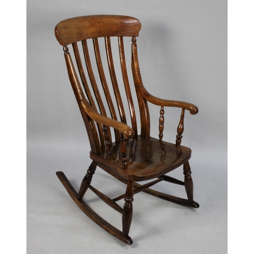 509 - A Windsor Rocking Chair with Scrolled Armrests