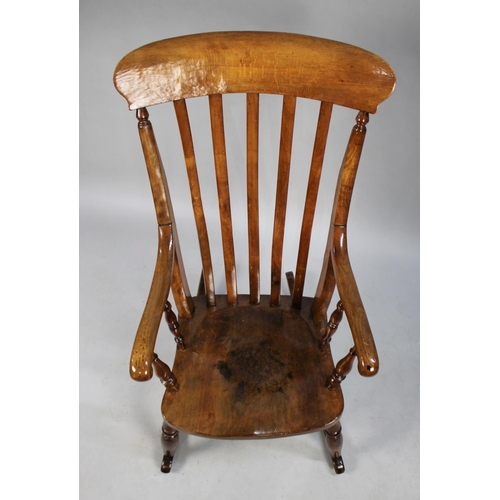 509 - A Windsor Rocking Chair with Scrolled Armrests