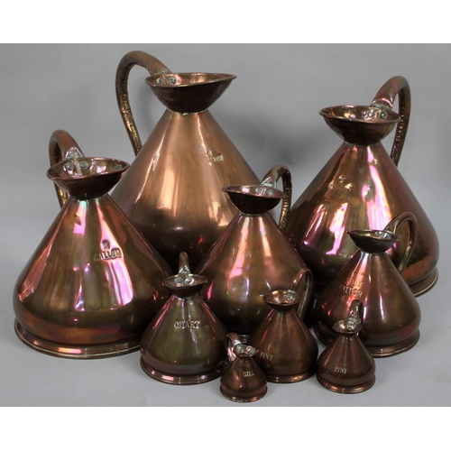 11 - A Set of Nine 19th Century Victorian Copper Haystack Measuring Jugs, Gill-4 Gallon, all with Leaded ... 