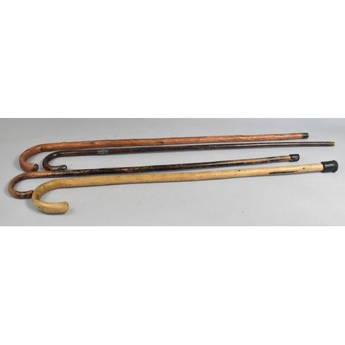 141 - A Collection of Four Vintage Walking Sticks, One with Silver Mounts