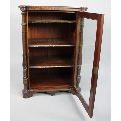 21 - A Victorian Walnut Music Cabinet with Turned Pilaster Decoration and Three Named Shelves