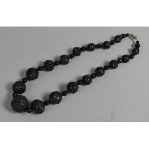 392 - A Late 19th Century Carved Jet Necklace of Graduated Bead Form, Barrel Clasp