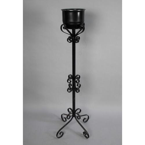 398 - A Wrought Iron Plant Stand with Scrolled Design and Quadrant Base, 116cms High