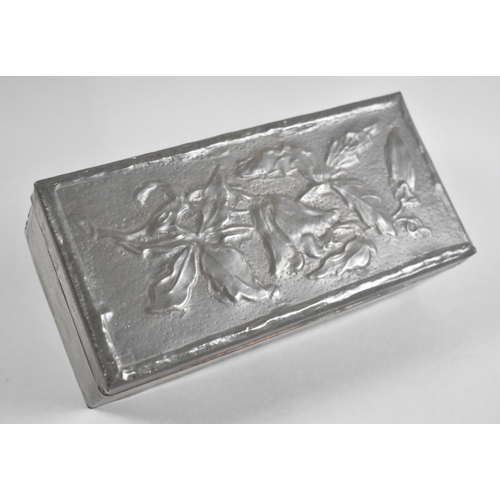 4 - An Edwardian Pewter Mounted Wooden Box, Hinged Lid Decorated in relief with Flowers, 18.5cms Wide