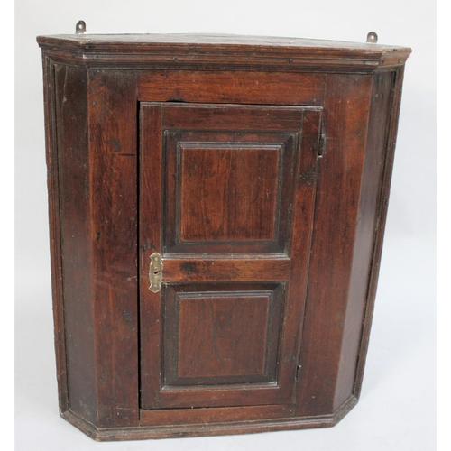 479 - A 19th Century Oak Wall Hanging Corner Cabinet with Panelled Door, 66cm wide