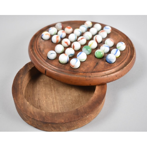 48 - A Far Eastern Wooden Circular Solitaire Board with Store Under and Set of Marbles, 20cms Diameter