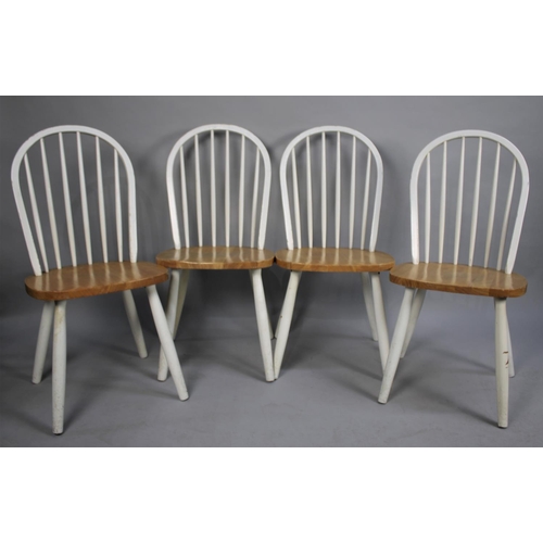 498 - A Set of Four Modern Comb Back Seated Dining Chairs