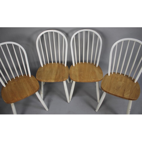 498 - A Set of Four Modern Comb Back Seated Dining Chairs