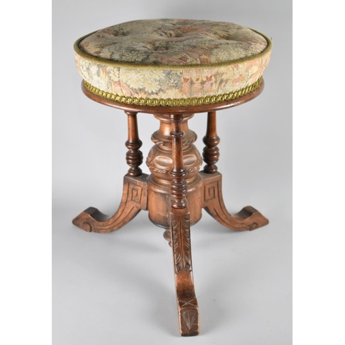 57 - A Late Victorian/Edwardian Circular Swivel Top Piano Stool with Tapestry Upholstery