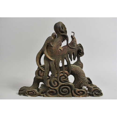 6 - An Ornamental Oriental Carved and Pierced Wooden Support in the Form of a Dragons Head, 30cms High