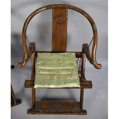 61 - A Pair of Chinese Hardwood Horseshoe-back Folding Chairs, Having Brass Mounts and Carved Front Decor... 