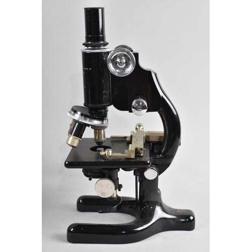 109 - A Vintage Cased Monocular Microscope with Accessories and Lenses