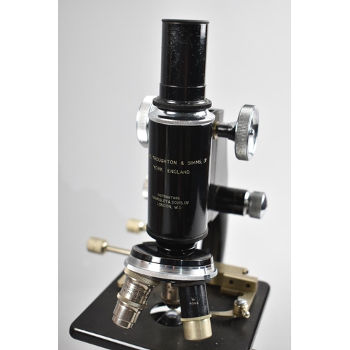 109 - A Vintage Cased Monocular Microscope with Accessories and Lenses