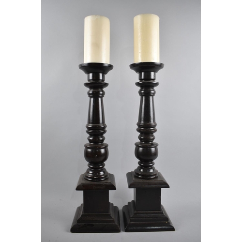 130 - A Pair of Modern Wooden Candle Prickets with Two Candles, 47cm high