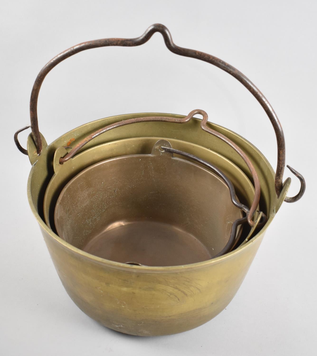 A Collection of Three Graduated Brass Jam Kettles, Largest 32cm