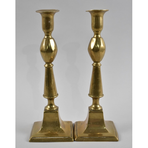 66 - A Pair of 19th Century Brass Candlesticks, 25cms High