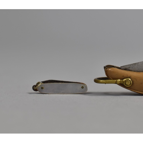 78 - A Vintage Novelty Folding Pocket Knife in the Form of a Ladies Shoe together with a Miniature Foldin... 