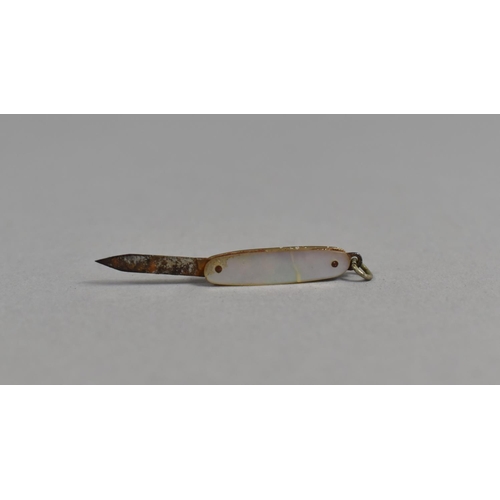 78 - A Vintage Novelty Folding Pocket Knife in the Form of a Ladies Shoe together with a Miniature Foldin... 