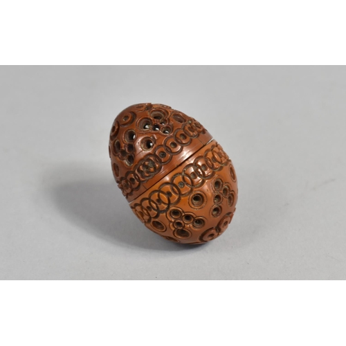 74 - A Late 19th Century Carved and Pierced Ovoid Thimble Case Containing Thimble, 4.75cms High