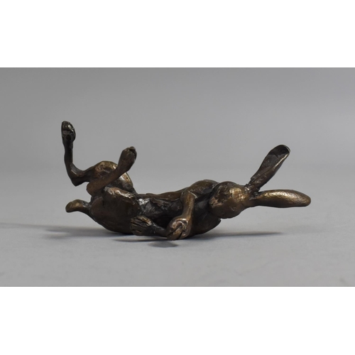 77 - A Small Patinated Bronze Study of Reclining Hare, 9cms Long