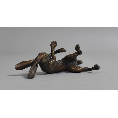 77 - A Small Patinated Bronze Study of Reclining Hare, 9cms Long