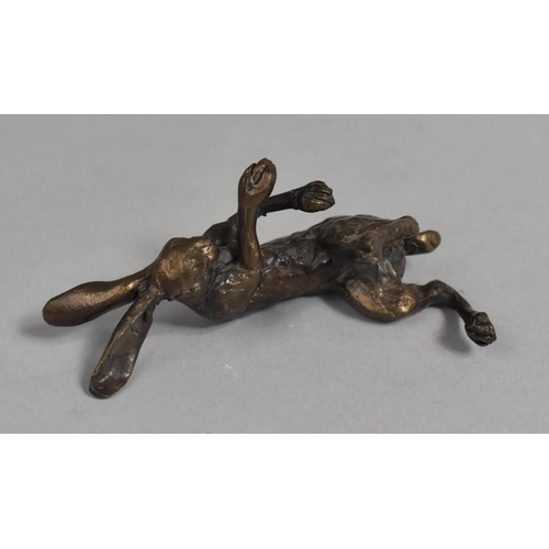 77 - A Small Patinated Bronze Study of Reclining Hare, 9cms Long