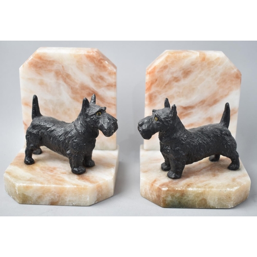 42 - A Pair of Novelty Bookends in the Form of Cold Painted Scottie Dogs on Veined Onyx Marble Stands, 12... 