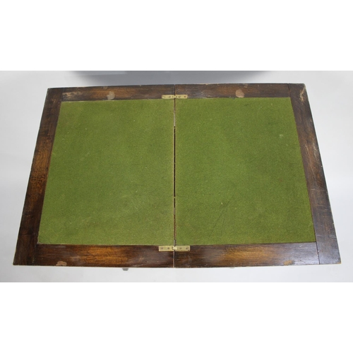 48 - An Edwardian Oak Lift and Twist Rectangular Topped Games Table, 76cms Wide When Open, with Stretcher... 
