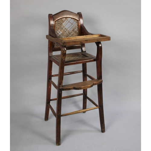 524 - An Edwardian Cane Seated and Back Child's High Chair