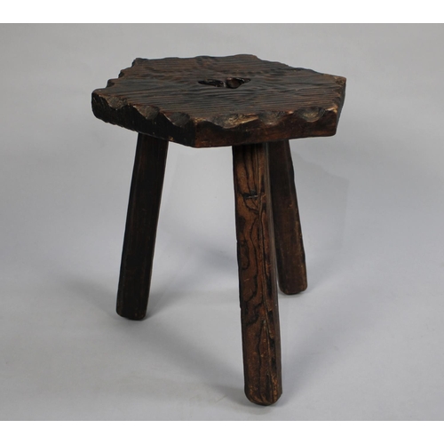 66 - A Mid 20th Century Rustic Three Legged Stool with Hexagonal Top, 37cms High