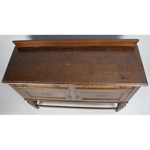 79 - An Edwardian Oak Galleried Sideboard with two Drawers over Cupboard Base, 121cms Wide