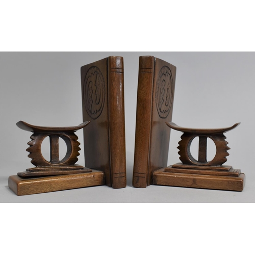 16 - A Pair of Carved Wooden Bookends in the Form of African Headrests, 16cms High