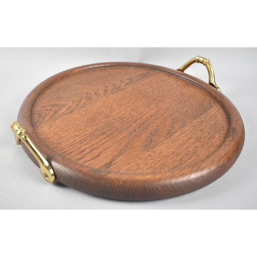 29 - A Modern Circular Oak Tray with Brass Carrying Handles, 32cms Diameter