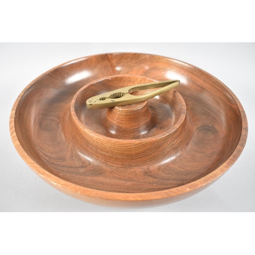 33 - A Large Modern Circular Wooden Nut Bowl with Brass Crackers, 36cms Diameter